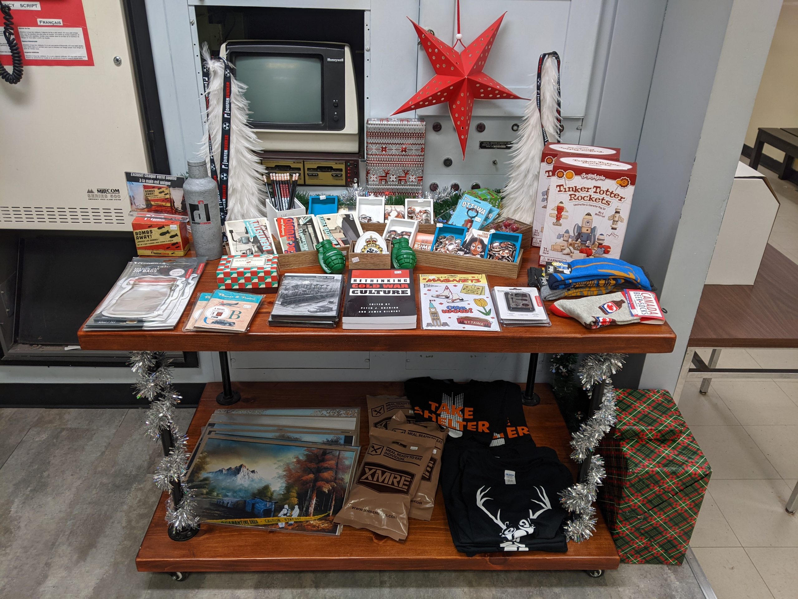 Table at the Diefenbunker with items from the Gift Shop and festive holiday decor