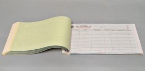 Open view of the Admission and Discharge Book from the Diefenbunker's collections.