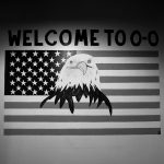 American flag with eagle overlayed on top with "Welcome to 0-0"