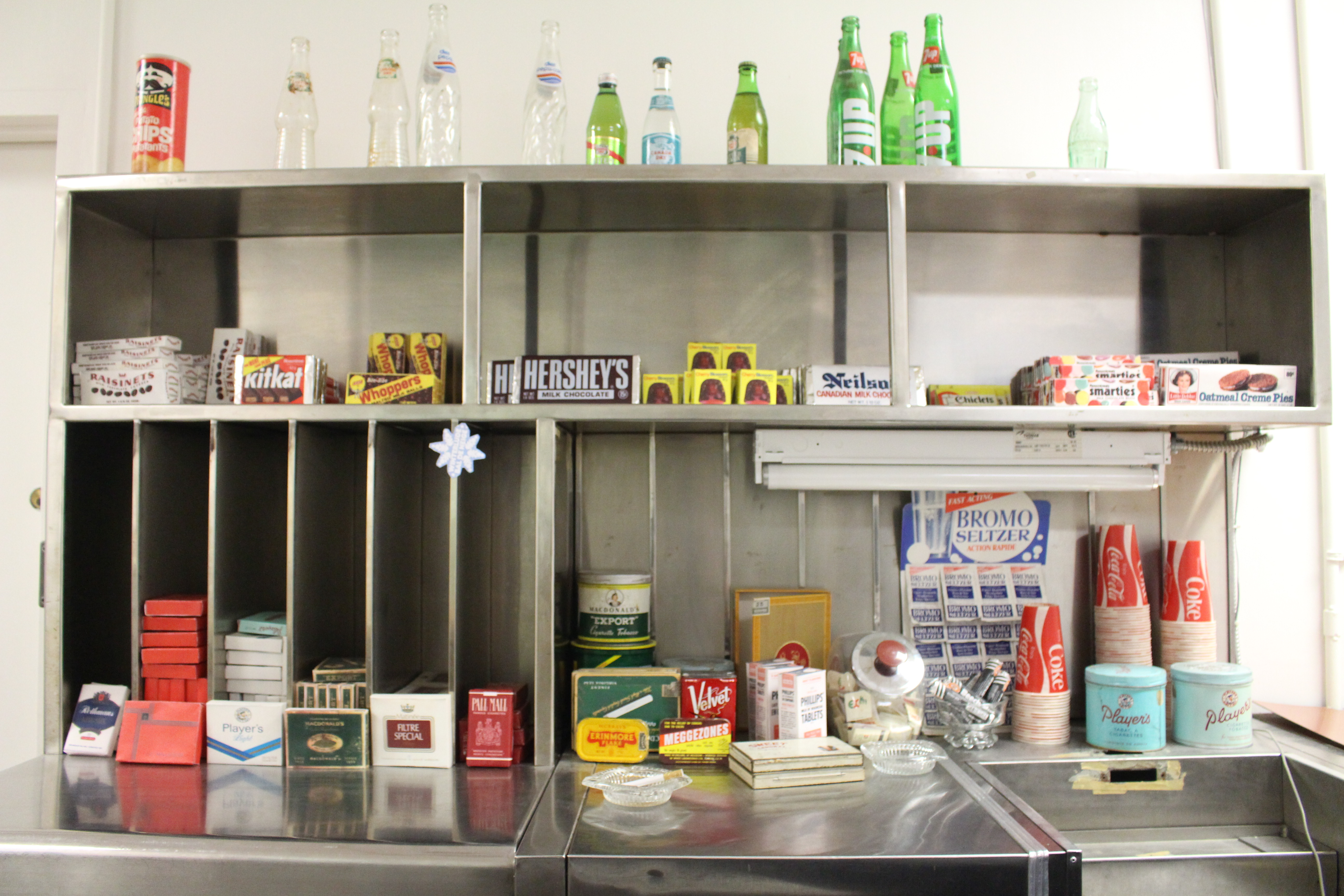 The Diefenbunker's CANEX with items including Gingerale, Hershey's chocolate, chips, etc. on the shelves.