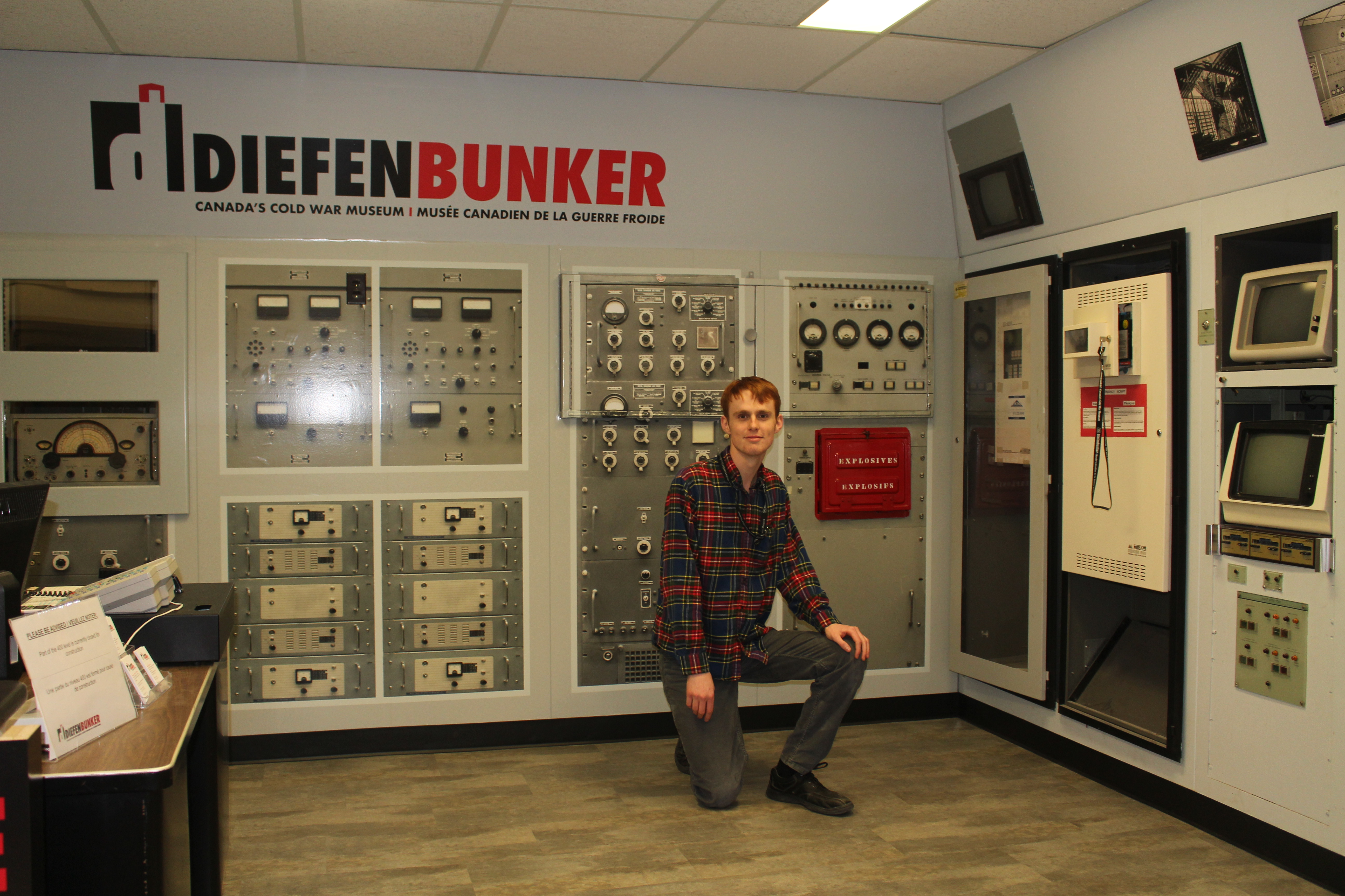 Hunter posing at the Diefenbunker's Welcome Desk.