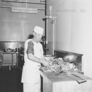 Cook prepares a meal in the Diefenbunker's kitchen.