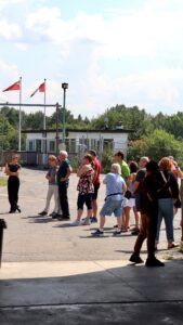 Visitors gather for a guided tour outside the Diefenbunker's Butler Hut. 