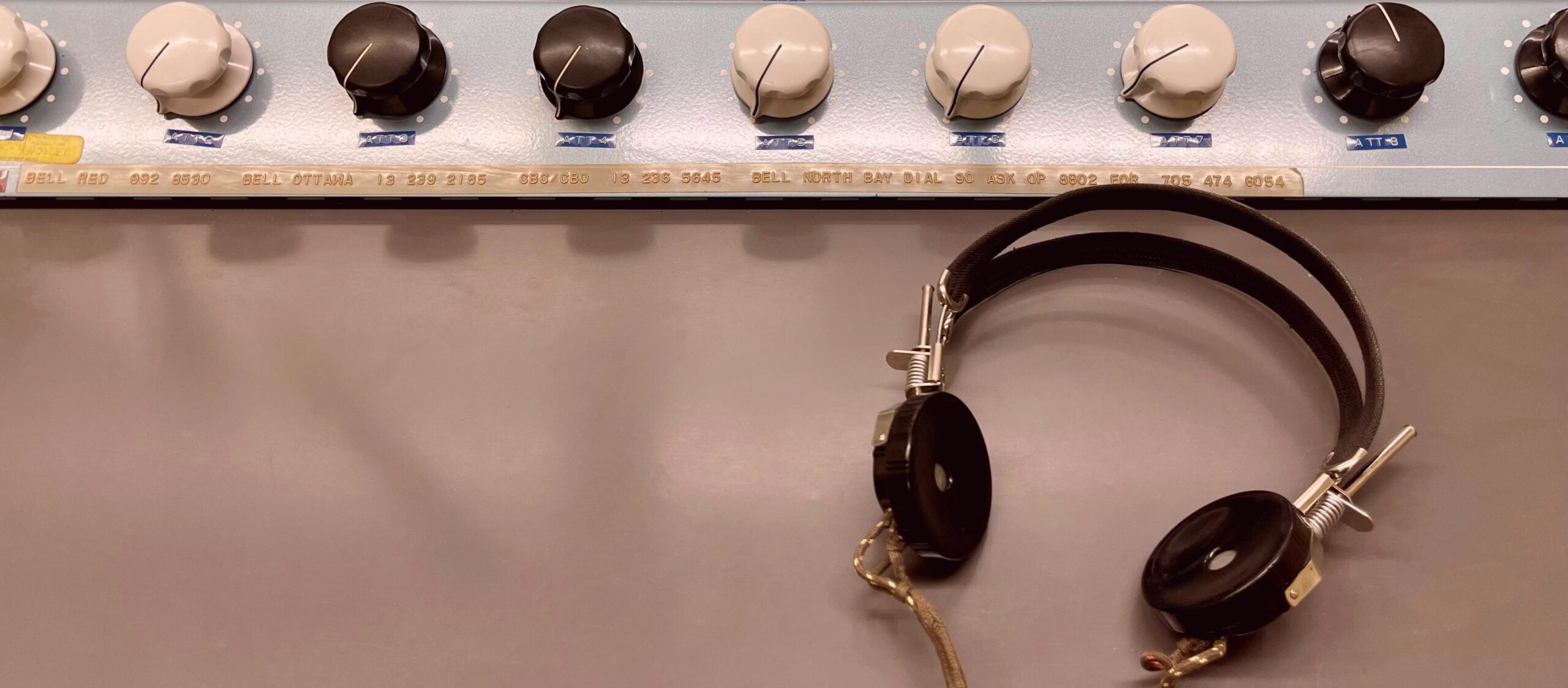 Headphones rest on the desk inside the Diefenbunker's CBC Radio Room.