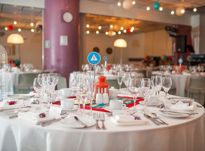 Tables decorated for a reception event inside the Diefenbunker's retro Cafeteria.