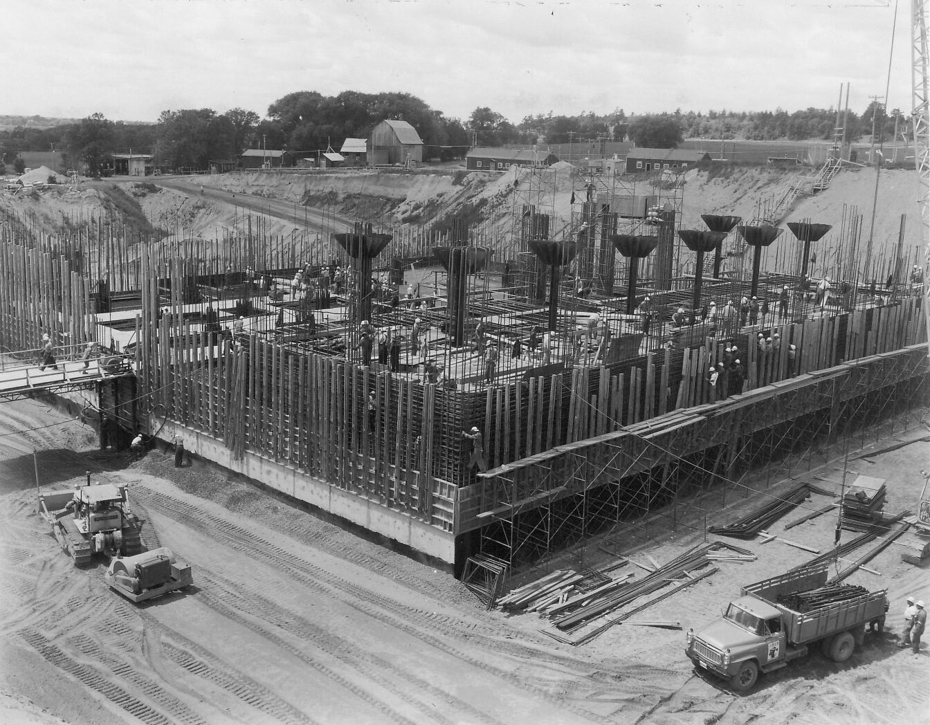 Diefenbunker under construction, showing exposed concrete pillars and rebar.