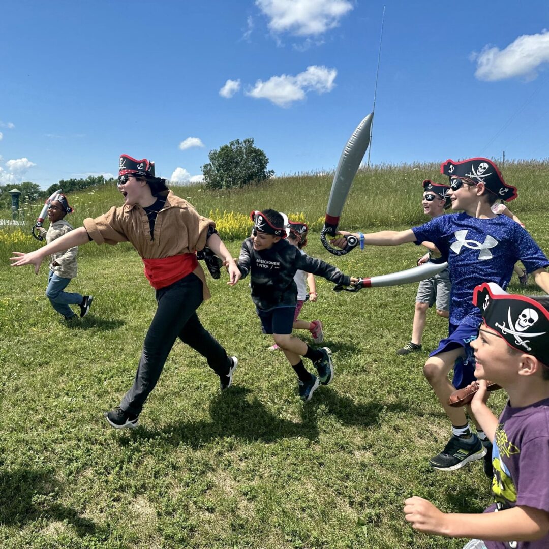 Kids play outside in costumes at the Diefenbunker's Spy Camp.