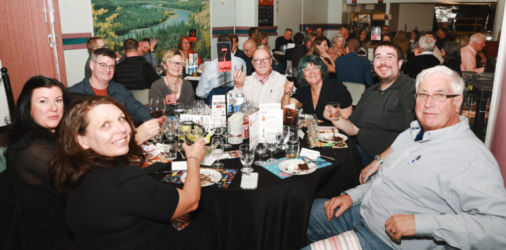 Guests pose with whisky glasses at the Diefenbunker's Whisky Tasting Fundraiser.