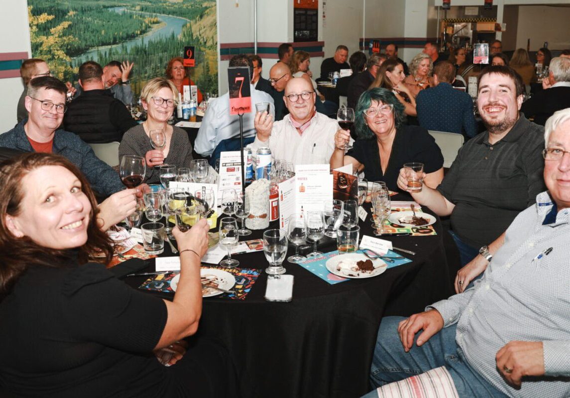 Guests pose with whisky glasses at the Diefenbunker's Whisky Tasting Fundraiser.