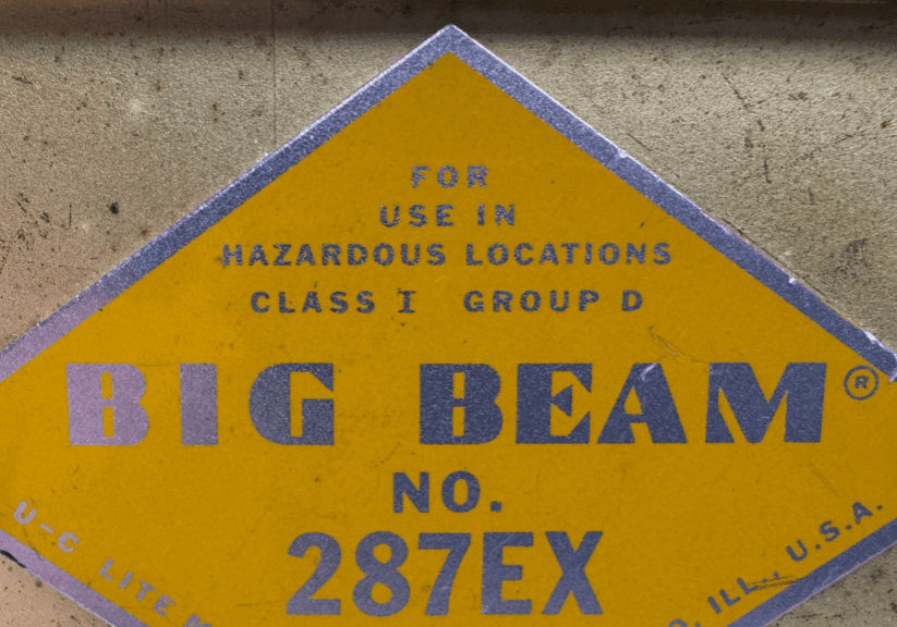 A yellow warning sign for hazardous locations, Class I Group D, labeled Big Beam No. 287EX.