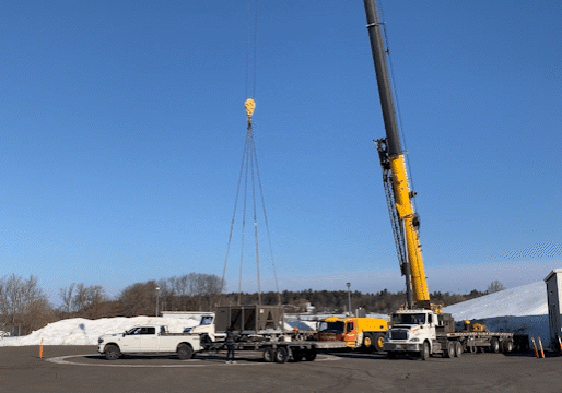 Crane lifts HVAC equipment onto the top of the hill above the Diefenbunker.