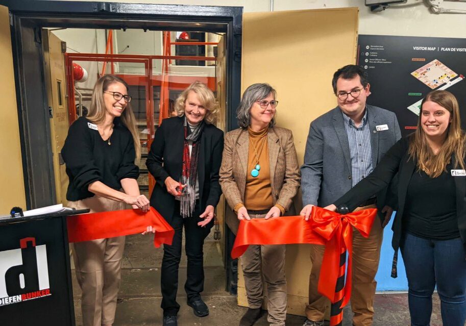 1: Ribbon-cutting ceremony to open an accessible public viewing platform in the Diefenbunker’s historic Machine Room, one of the museum’s newest initiatives funded by the Ontario Trillium Foundation. Pictured left to right: Christine McGuire, Diefenbunker Executive Director; Karen McCrimmon, MPP for Kanata—Carleton; Mary Mercer, Ontario Trillium Foundation volunteer; Sean Campbell, Diefenbunker Curator; Tobie Champion-Demers, Diefenbunker Facilities and Project Manager. Image courtesy of the Diefenbunker: Canada’s Cold War Museum.