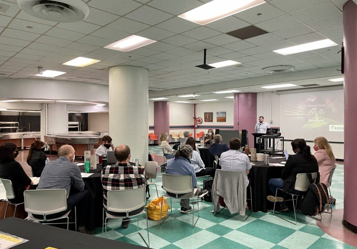 Symposium participants gather in the Cafeteria