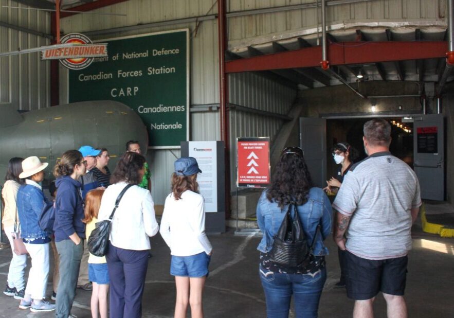 Visitors on a guided tour inside the entrance to the Diefenbunker, formerly CFS Carp.