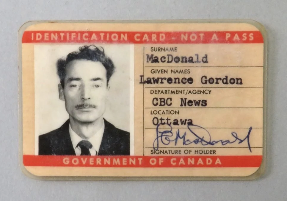 A canadian id card with an asian man 's picture.